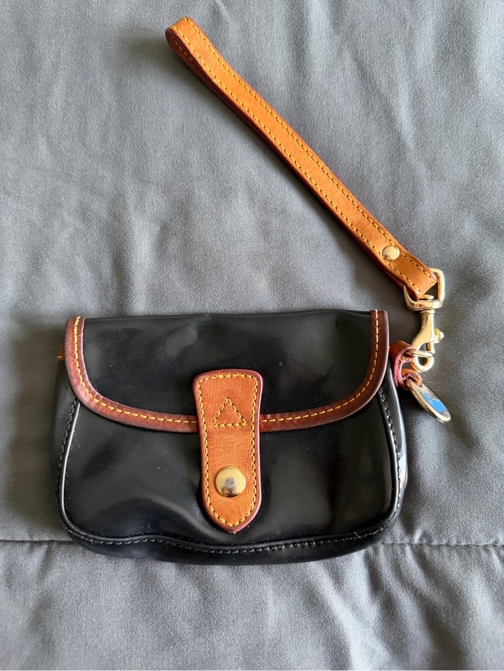 Dooney & Bourke Black Patent Wristlet with Tan Trim